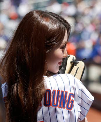 Jang Won-young of the K-pop girl group Ive stands on the field before throwing out the first pitch when the Los Angeles Dodgers play the New York Mets at Citi Field on Sunday, July 26, 2026 in New York City.  NYP20260726112 JOHNxANGELILLO