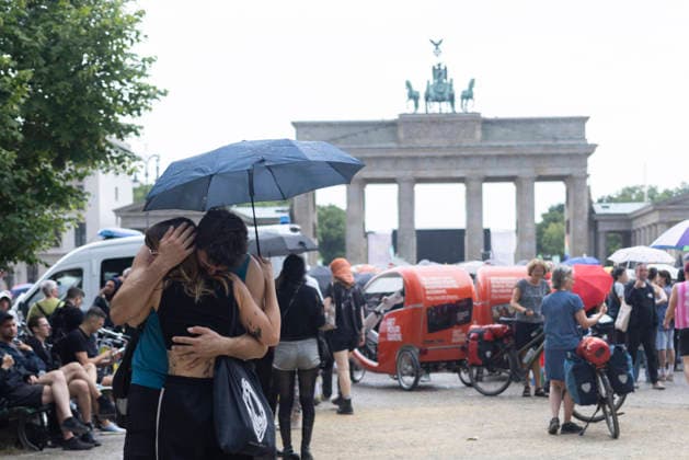 July 26, 2026, Berlin, Berlin, Germany: A vigil was held at Brandenburg Gate in Berlin in solidarity with those affected by the attack following Christopher Street Day (CSD), and with the victimsÃ¢â‚¬â ¢ families and friends. Members of the LGBTQIA+ community and allies gathered to mourn, express their anger, and turn grief into resistance against hatred and discrimination. Berlin Germany - ZUMAb284 20260726_zip_b284_022 Copyright: xZairaxBiaginix