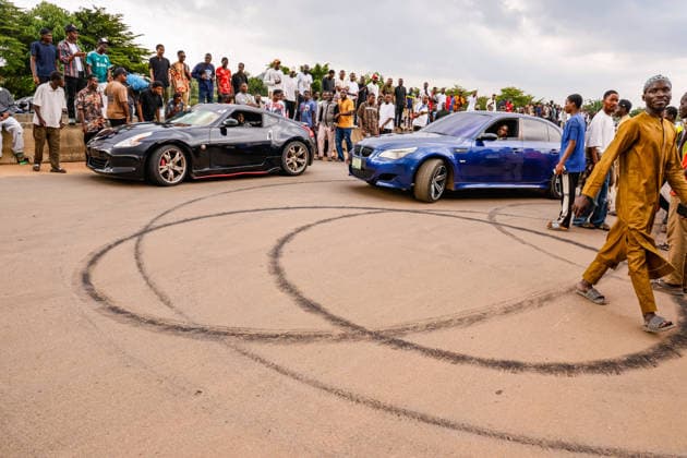 Nigerian youth showcase passion for car racing ABUJA, NIGERIA - JULY 26: Young car enthusiasts compete with their modified vehicles during a car racing event in Abuja, Nigeria, on July 26, 2026. The event features classic and sports cars as participants showcase their driving skills and passion for automobiles. Emmanuel Osodi Anadolu Abuja Nigeria. Editorial use only. Please get in touch for any other usage.  Copyright: x2026xAnadoluxEmmanuelxOsodix