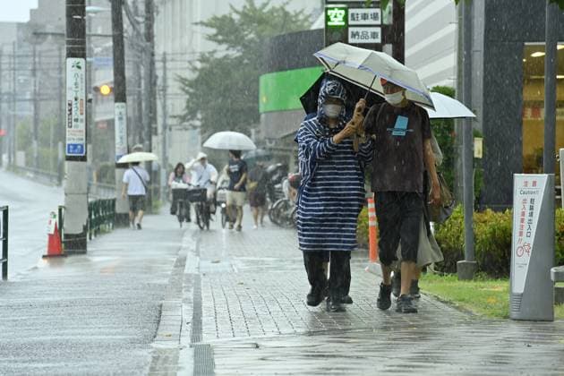 Sudden summer thunderstorm interrupts relief from Tokyo heat TOKYO, JAPAN - JULY 26 : Pedestrians walk with umbrellas as heavy rain falls in Tokyo, Japan, on July 26, 2026, after a period of intense summer heat. David Mareuil Anadolu Tokyo Japan. Editorial use only. Please get in touch for any other usage.  Copyright: x2026xAnadoluxDavidxMareuilx
