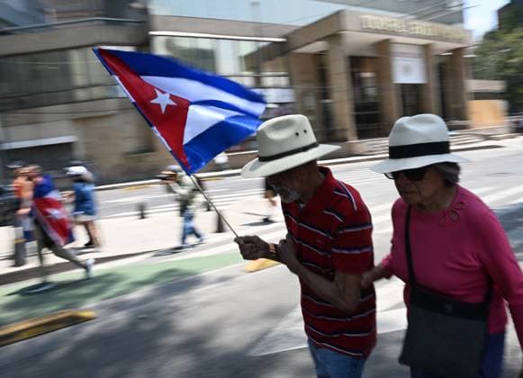 (260726) -- MEXICO CITY, July 26, 2026 -- Protesters march during a demonstration in support of Cuba and against U.S. embargo on Cuba, in Mexico City, Mexico on July 26, 2026. The demonstration aimed to commemorate the 73rd anniversary of the assault on Moncada and Carlos Manuel de Cespedes garrisons that took place on July 26, 1953, seen as the beginning of the Cuban Revolution. ) MEXICO-MEXICO CITY-SUPPORT CUBA WuxWei 