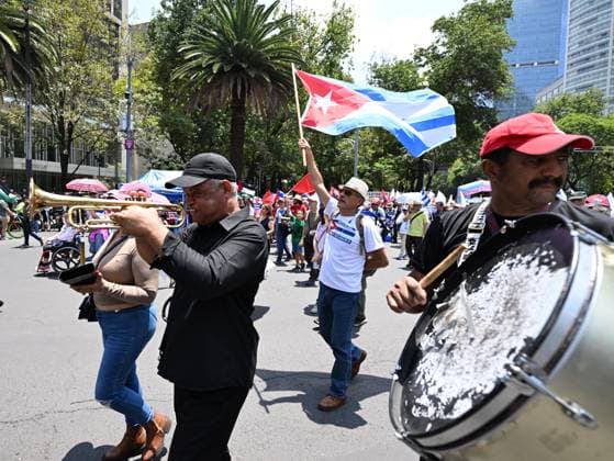 (260726) -- MEXICO CITY, July 26, 2026 -- Protesters march during a demonstration in support of Cuba and against U.S. embargo on Cuba, in Mexico City, Mexico on July 26, 2026. The demonstration aimed to commemorate the 73rd anniversary of the assault on Moncada and Carlos Manuel de Cespedes garrisons that took place on July 26, 1953, seen as the beginning of the Cuban Revolution. ) MEXICO-MEXICO CITY-SUPPORT CUBA WuxWei 