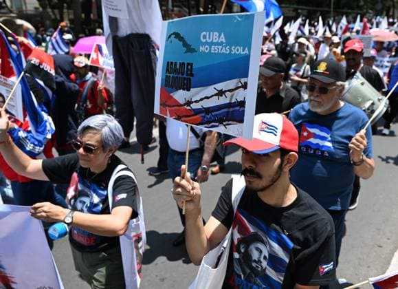 (260726) -- MEXICO CITY, July 26, 2026 -- Protesters march during a demonstration in support of Cuba and against U.S. embargo on Cuba, in Mexico City, Mexico on July 26, 2026. The demonstration aimed to commemorate the 73rd anniversary of the assault on Moncada and Carlos Manuel de Cespedes garrisons that took place on July 26, 1953, seen as the beginning of the Cuban Revolution. ) MEXICO-MEXICO CITY-SUPPORT CUBA WuxWei 