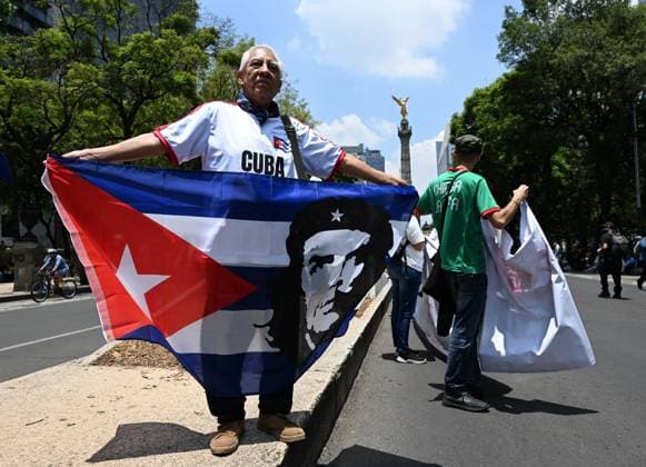 (260726) -- MEXICO CITY, July 26, 2026 -- Protesters march during a demonstration in support of Cuba and against U.S. embargo on Cuba, in Mexico City, Mexico on July 26, 2026. The demonstration aimed to commemorate the 73rd anniversary of the assault on Moncada and Carlos Manuel de Cespedes garrisons that took place on July 26, 1953, seen as the beginning of the Cuban Revolution. ) MEXICO-MEXICO CITY-SUPPORT CUBA WuxWei 