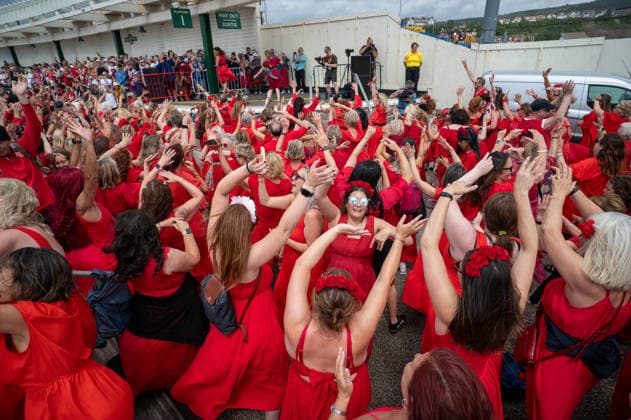 July 26, 2026, Folkstone, Kent, United Kingdom: Participants in the Most Wuthering Heights Day Ever wave their hands as they perform one of the event s scheduled dances. Folkestone once again hosted The Most Wuthering Heights Day Ever, as hundreds of participants dressed in flowing red gathered to recreate the iconic dance from Kate Bush s 1978 hit, Wuthering Heights. Continuing a tradition that began in 2018, the event welcomed both returning dancers and newcomers, celebrating music, creativity, and community while transforming the Harbour Arm into a sea of red. Folkstone United Kingdom  - ZUMAs197 20260726_aaa_s197_147 Copyright: xJamesxWilloughbyx