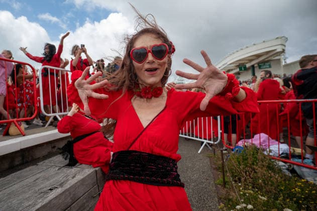 July 26, 2026, Folkstone, Kent, United Kingdom: A participant dressed as Cathy takes part in the Most Wuthering Heights Day Ever in Folkestone. Folkestone once again hosted The Most Wuthering Heights Day Ever, as hundreds of participants dressed in flowing red gathered to recreate the iconic dance from Kate Bush s 1978 hit, Wuthering Heights. Continuing a tradition that began in 2018, the event welcomed both returning dancers and newcomers, celebrating music, creativity, and community while transforming the Harbour Arm into a sea of red. Folkstone United Kingdom  - ZUMAs197 20260726_aaa_s197_148 Copyright: xJamesxWilloughbyx