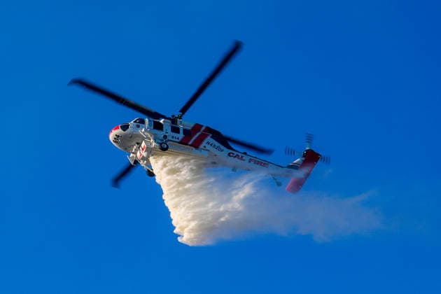 Mines Fire of wildfire continues in Santa Clara County of California SANTA CLARA COUNTY, CALIFORNIA - JULY 26: A fire helicopter drops water on burning areas as crews battle with wildfire named as Mines Fire in Santa Clara County, California on July 26, 2026. Tayfun Coskun Anadolu California United States. Editorial use only. Please get in touch for any other usage.  Copyright: x2026xAnadoluxTayfunxCoskunx