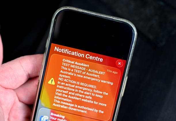 NATIONAL AUSALERT TEST, The text message from the National AusAlert system is displayed on an iPhone in Brisbane, Monday, July 27, 2026. ( NO ARCHIVING BRISBANE QUEENSLAND AUSTRALIA  Copyright: xDARRENxENGLANDx 20260727175935173837