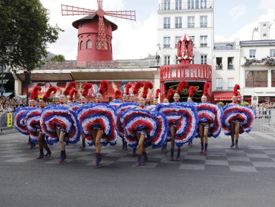 Tour de France cyclists pass by the Moulin Rouge during the final stage in Paris on July 26, 2026. The Moulin Rouge dancers perform before the Tour de France cyclists pass by. On this exceptional occasion, the famous Moulin Rouge dancers step out in front of the cabaret to put on a unique show. Dressed in their flamboyant tricolor costumes, they perform their iconic French Cancan to cheer on the cyclists as they enter the final stretch of their epic journey Marc Ausset Lacroix Bestimage Tour de France riders passing the Moulin Rouge during the final stage in Paris on July 26, 2026—Moulin Rouge dancers perform before the riders pass by For this special occasion, the famous Moulin Rouge dancers step out in front of the cabaret to put on a un  Copyright: xMarcxAussetxLacroixx xBestimagexMarcxAussetxLacroixx xBestimagex