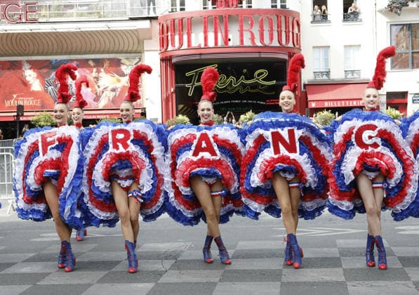 Tour de France cyclists pass by the Moulin Rouge during the final stage in Paris on July 26, 2026. The Moulin Rouge dancers perform before the Tour de France cyclists pass by. On this exceptional occasion, the famous Moulin Rouge dancers step out in front of the cabaret to put on a unique show. Dressed in their flamboyant tricolor costumes, they perform their iconic French Cancan to cheer on the cyclists as they enter the final stretch of their epic journey Marc Ausset Lacroix Bestimage Tour de France riders passing the Moulin Rouge during the final stage in Paris on July 26, 2026—Moulin Rouge dancers perform before the riders pass by For this special occasion, the famous Moulin Rouge dancers step out in front of the cabaret to put on a un  Copyright: xMarcxAussetxLacroixx xBestimagexMarcxAussetxLacroixx xBestimagex
