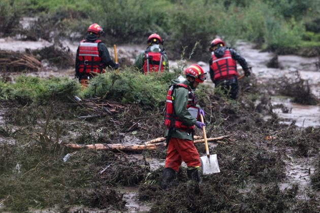 (260727) -- WEIYUAN, July 27, 2026 -- Rescuers work at the flood-hit area in Weiyuan County, northwest China s Gansu Province, July 27, 2026. The flash flood, triggered by sudden heavy rainfall, hit a scenic area in Weiyuan County, Dingxi City, on Sunday afternoon, leaving 10 people dead and 23 injured as of 6 p.m. ? ?Some tourists were camping in the scenic area and were trapped after the flood burst out, local authorities said. ? ?A total of 305 rescue personnel with 68 vehicles from the national comprehensive fire and rescue teams are conducting rescue operations at the site, according to the MEM. ) (SpotNews) CHINA-GANSU-WEIYUAN-FLASH FLOOD-RESCUE AND RELIEF WORK (CN) ChenxBin 