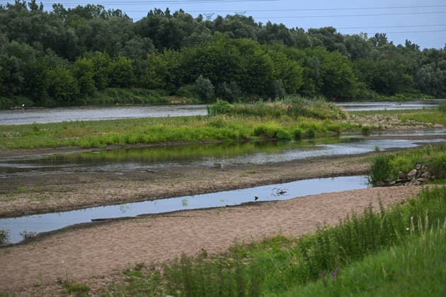 Poland s San River with low water levels as drought intensifies STALOWA WOLA, POLAND- JULY 27: A view of San River with low water levels due to the ongoing drought in Poland in Stalowa Wola, Poland on July 27, 2026. Currently, low water levels have been recorded at 66 percent of Poland’s hydrological stations. Warnings over worsening dry conditions were issued earlier in July, when Poland’s national weather agency said hydrological drought had spread across much of the country. Officials reported falling river levels, reduced groundwater supplies and more monitoring stations recording flows below long-term minimum thresholds. At the end of this week, a heatwave is predicted with temperatures to raise above 35 Celsius degrees. Omar Marques  Copyright: x2026xAnadoluxOmarxMarquesx
