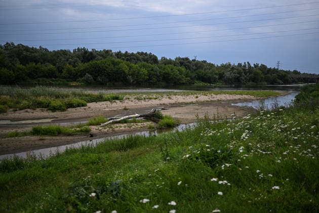 Poland s San River with low water levels as drought intensifies STALOWA WOLA, POLAND- JULY 27: A view of San River with low water levels due to the ongoing drought in Poland in Stalowa Wola, Poland on July 27, 2026. Currently, low water levels have been recorded at 66 percent of Poland’s hydrological stations. Warnings over worsening dry conditions were issued earlier in July, when Poland’s national weather agency said hydrological drought had spread across much of the country. Officials reported falling river levels, reduced groundwater supplies and more monitoring stations recording flows below long-term minimum thresholds. At the end of this week, a heatwave is predicted with temperatures to raise above 35 Celsius degrees. Omar Marques  Copyright: x2026xAnadoluxOmarxMarquesx