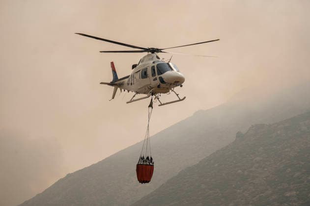 The fire in Ávila is now the largest in Spain’s history, having burned 55,000 hectares. A helicopter is assisting with firefighting efforts on July 27, 2026, in Mijares, Ávila, Castile and León, Spain. The Burgohondo forest fire in Ávila has burned 55,000 hectares, making it the largest fire on record in Spain. Currently, firefighting efforts are focused on two active zones of concern to firefighters: the Mijares Pass and the area surrounding the town of Casillas. July 27, 2026 Ávila, Castile and León, Spain  Copyright: xAlbertoxOrtegax 7689407