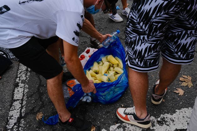 July 27, 2026, U.S.: Demonstrators open bags of peppers and tomatoes to throw during a morning protest on the 57th day of the Flamingo Revolution in Tirana, Albania, as a parliament meeting begins next door. U.S.  - ZUMAm354 20260727_znp_m354_003 Copyright: xMadiganxMurphyx