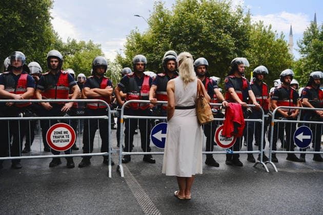 July 27, 2026, U.S.: An Albanian woman stands before police outside of a parliament meeting in Tirana, Albania, on the 57th day of the Flamingo Revolution against Prime Minister EDI RAMA s government. U.S.  - ZUMAm354 20260727_znp_m354_004 Copyright: xMadiganxMurphyx