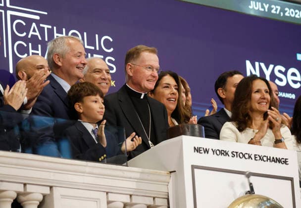 Representatives of Catholic Charities ring the opening bell at the New York Stock Exchange on Wall Street on Monday, July 27, 2026 in New York City. The DOW began the day up over 600 points before falling back a bit but chip stocks. There was a pause in Iran fighting over the weekend.  NYP20260727101 JOHNxANGELILLO