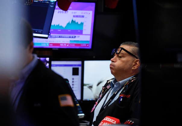 Traders work on the floor of the New York Stock Exchange on Wall Street on Monday, July 27, 2026 in New York City. The DOW began the day up over 600 points before falling back a bit but chip stocks. There was a pause in Iran fighting over the weekend.  NYP20260727105 JOHNxANGELILLO