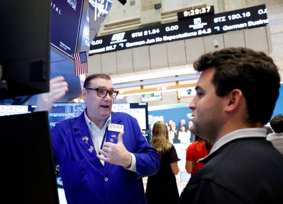 Traders work on the floor of the New York Stock Exchange on Wall Street on Monday, July 27, 2026 in New York City. The DOW began the day up over 600 points before falling back a bit but chip stocks. There was a pause in Iran fighting over the weekend.  NYP20260727111 JOHNxANGELILLO