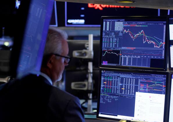 Traders work on the floor of the New York Stock Exchange on Wall Street on Monday, July 27, 2026 in New York City. The DOW began the day up over 600 points before falling back a bit but chip stocks. There was a pause in Iran fighting over the weekend.  NYP20260727112 JOHNxANGELILLO