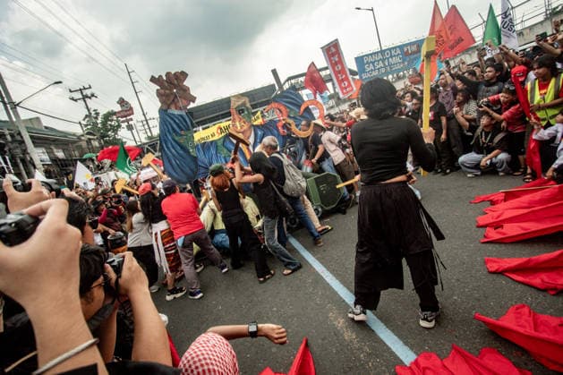 July 27, 2026, Quezon, Metro Manila, Philippines: Numbering in the thousands, multi-sectoral groups marched along Commonwealth Avenue for the Ã¢â‚¬ËœPeopleÃ¢â‚¬â ¢s SONAÃ¢â‚¬â ¢, coinciding with the 5th State of the Nation Address of Pres. Ferdinand Marcos Jr., July 27. Protesters called for greater accountability amidst government impunity, and the rejection of imperialist control of the United States over the Philippines in face of projects such as the Pax Silica Initiative which threatens to intensify issues of displacement and large-scale mining in the country. Quezon Philippines - ZUMAs383 20260727_zip_s383_016 Copyright: xNathanielxSorianox