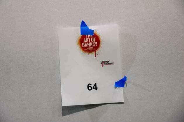 July 27, 2026, Tampa, Florida, USA: A temporary sign is placed on a display wall where an art piece by street artist, Banksy, will be hung at the Straz Center on Monday, July 27, 2026, in Tampa. Tampa USA  - ZUMAs70_ 20260727_zan_s70_015 Copyright: xJeffereexWoox