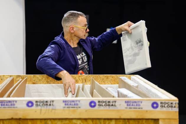 July 27, 2026, Tampa, Florida, USA: Richard Wormley, an assistant curator, goes through a crate of art pieces by street artist, Banksy, at the Straz Center on Monday, July 27, 2026, in Tampa. Tampa USA  - ZUMAs70_ 20260727_zan_s70_017 Copyright: xJeffereexWoox