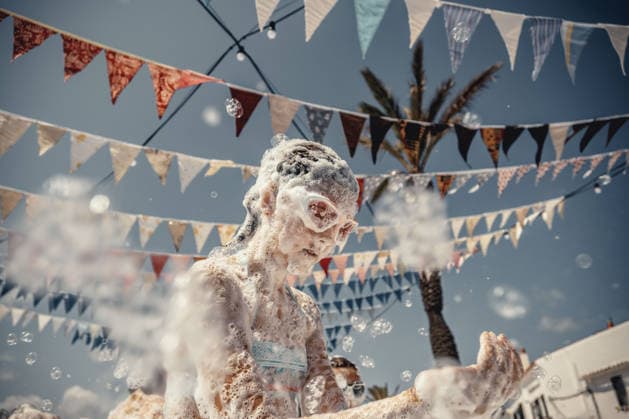 July 27, 2026, Fornells, Menorca Balearic Islands, Spain: Children get covered in foam as they participate in a foam party looking for some refreshment during the traditional Sant AntoniFestival in Fornells Fornells Spain  - ZUMAo105 20260727_fap_o105_001 Copyright: xMatthiasxOesterlex
