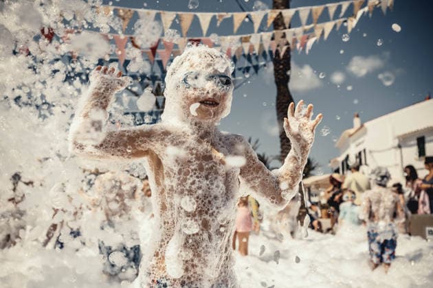 July 27, 2026, Fornells, Menorca Balearic Islands, Spain: Children get covered in foam as they participate in a foam party looking for some refreshment during the traditional Sant AntoniFestival in Fornells Fornells Spain  - ZUMAo105 20260727_fap_o105_002 Copyright: xMatthiasxOesterlex