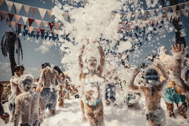 July 27, 2026, Fornells, Menorca Balearic Islands, Spain: Children get covered in foam as they participate in a foam party looking for some refreshment during the traditional Sant AntoniFestival in Fornells Fornells Spain - ZUMAo105 20260727_fap_o105_003 Copyright: xMatthiasxOesterlex