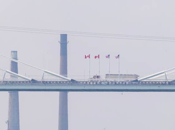 (260727) -- WINDSOR(CANADA), July 27, 2026 -- A truck heading into Canada on the Gordie Howe International Bridge is pictured from the Canadian side in Windsor, Ontario, Canada, on July 27, 2026. Canada on Monday opened a new international bridge linking Windsor, Ontario and Detroit, U.S., providing the newest and largest land border crossing with the United States despite escalating trade tensions between the two countries. (Photo by Xinhua) CANADA-U.S.-BORDER BRIDGE-OPENING ZouxZheng 
