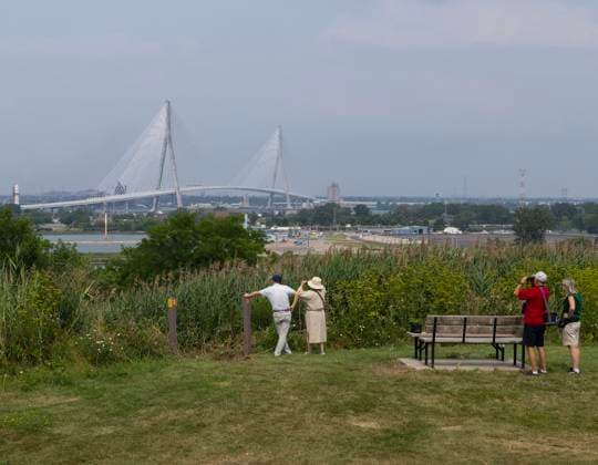 (260727) -- WINDSOR(CANADA), July 27, 2026 -- People view the Gordie Howe International Bridge from the Canadian side in Windsor, Ontario, Canada, on July 27, 2026. Canada on Monday opened a new international bridge linking Windsor, Ontario and Detroit, U.S., providing the newest and largest land border crossing with the United States despite escalating trade tensions between the two countries. (Photo by Xinhua) CANADA-U.S.-BORDER BRIDGE-OPENING ZouxZheng 
