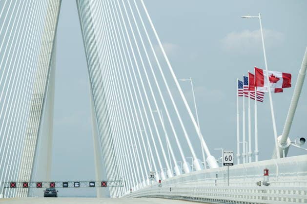 July 27, 2026, Windsor, On, CANADA: The American and Canadian flags fly at the halfway point of the Gordie Howe International Bridge in Windsor, Ont., on the first day open to vehicles, Monday, July 27, 2026. Windsor CANADA  - ZUMAc35_ 20260727_zaf_c35_079 Copyright: xDaxxMelmerx