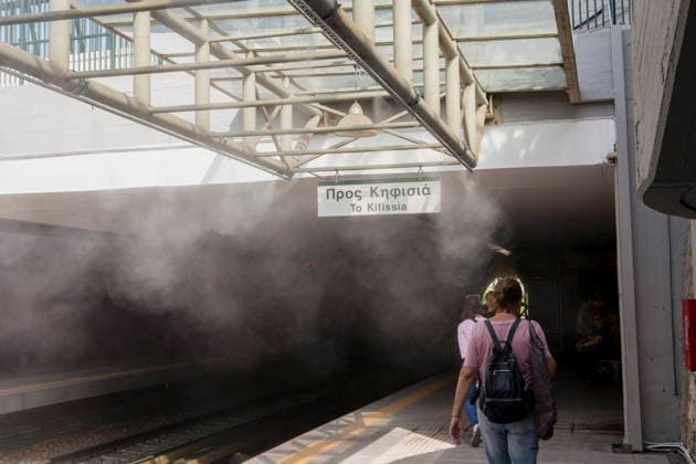 Athens Greece Heatwave People walk past water spray on the platform at Thiseio station in Athens, Attica, Greece on July 27, 2026. The water spray system operates as high summer temperatures persist in the Greek capital. Athens Attica Greece Copyright: xElvisxTakahashixMantellox