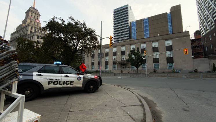 (260728) -- TORONTO, July 28, 2026 -- A police vehicle is seen near the U.S. Consulate in downtown Toronto, Canada, July 27, 2026. The U.S. Consulate in downtown Toronto was targeted in a shooting early Monday morning, marking the second time this year the building has been attacked, according to local media reports. (Photo by Xinhua) (SpotNews) CANADA-TORONTO-U.S. CONSULATE-SHOOTING LixHaitao 