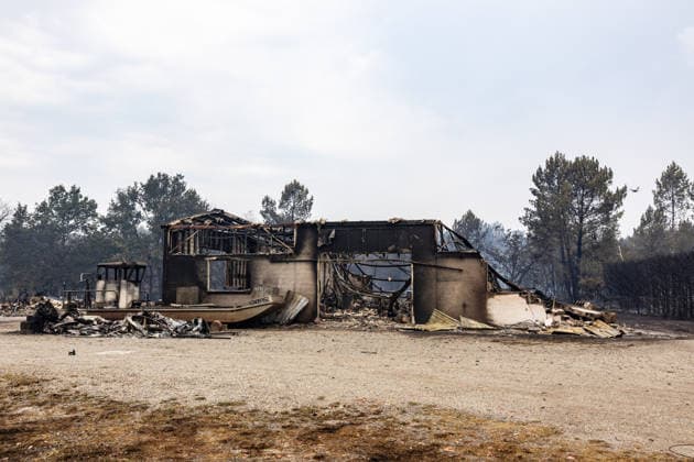 Burned Properties After The Gironde Wildfires - Lege Burned residential properties are seen after the passage of the wildfire, smoke continues to rise from the affected areas as firefighters monitor remaining hotspots in Lège, France, on July 27, 2026. Photo by Margot Le Gonidec ABACAPRESS.COM Lège France  Copyright: xLexGonidecxMargot ABACAx