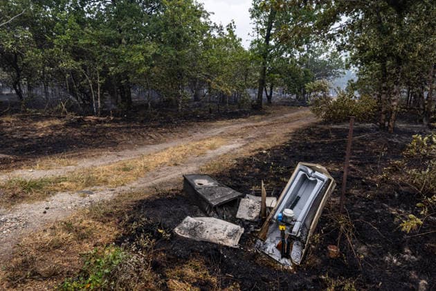 Burned Properties After The Gironde Wildfires - Lege Burned residential properties are seen after the passage of the wildfire, smoke continues to rise from the affected areas as firefighters monitor remaining hotspots in Lège, France, on July 27, 2026. Photo by Margot Le Gonidec ABACAPRESS.COM Lège France  Copyright: xLexGonidecxMargot ABACAx