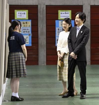 Japan crown prince at high school cultural festival Japan s Crown Prince Fumihito and Crown Princess Kiko (C) chat with a student while looking at calligraphy works during a national high school cultural festival in the northeastern Japan city of Akita on July 27, 2026.  A14AA0005624302P