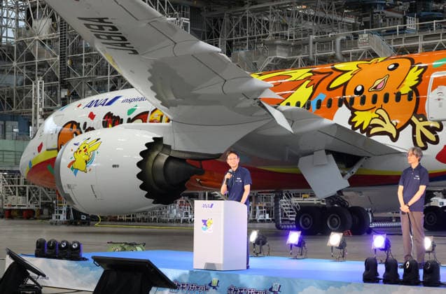July 28, 2026, Tokyo, Japan - All Nippon Airways (ANA) executive vice president Keiji Omae (L) delivers a speech while Pokemon company COO Takato Utsunomiya (R) while looks on as ANA displays the special designed aircraft with Pokemon characters Red Pokemon Jet to mark the 30th annivrersary of the partnership of ANA and Pokemon at the ANA hangar near the Haneda airport in Tokyo on Tuesday, July 28, 2026. ANA will start domestic flight services of Red Pokemon Jet from July 29. (photo by Yoshio Tsunoda AFLO)  aflo_339375472