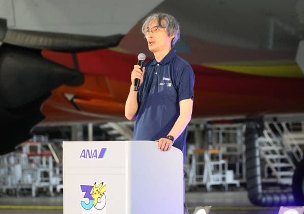 July 28, 2026, Tokyo, Japan - Pokemon company COO Takato Utsunomiya delivers a speech as All Nippon Airways (ANA) displays the special designed aircraft with Pokemon characters Red Pokemon Jet to mark the 30th annivrersary of the partnership of ANA and Pokemon at the ANA hangar near the Haneda airport in Tokyo on Tuesday, July 28, 2026. ANA will start domestic flight services of Red Pokemon Jet from July 29. (photo by Yoshio Tsunoda AFLO)  aflo_339375480