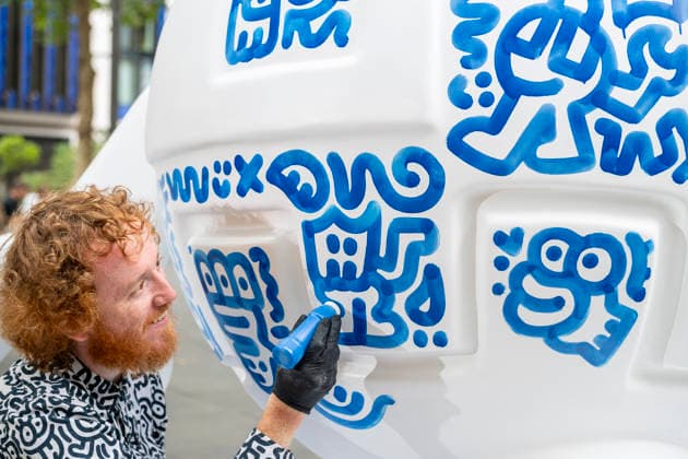 July 28, 2026, London, London, UK: LONDON, UK. Ã¢â‚¬ËœBlue RobotÃ¢â‚¬â ¢ is created in Leicester Square. Art of London launches Mr DoodleÃ¢â‚¬â ¢s Doodle Discovery, a free art trail featuring a live doodling workshop and five specially commissioned sculptures across LondonÃ¢â‚¬â ¢s West End by internationally acclaimed artist Sam Cox, known professionally as Mr Doodle (pictured). The public art experience is on display until 30 August 2026. London UK  - ZUMAl94_ 20260728_zaf_l94_009 Copyright: xStephenxChungx