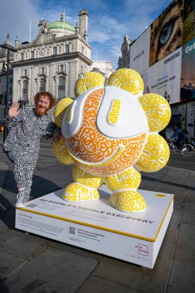 July 28, 2026, London, London, UK: LONDON, UK. Ã¢â‚¬ËœYellow FlowerÃ¢â‚¬â ¢ in Piccadilly Circus. Art of London launches Mr DoodleÃ¢â‚¬â ¢s Doodle Discovery, a free art trail featuring a live doodling workshop and five specially commissioned sculptures across LondonÃ¢â‚¬â ¢s West End by internationally acclaimed artist Sam Cox, known professionally as Mr Doodle (pictured). The public art experience is on display until 30 August 2026. London UK  - ZUMAl94_ 20260728_zaf_l94_012 Copyright: xStephenxChungx