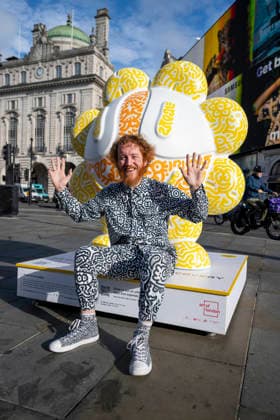 July 28, 2026, London, London, UK: LONDON, UK. Ã¢â‚¬ËœYellow FlowerÃ¢â‚¬â ¢ in Piccadilly Circus. Art of London launches Mr DoodleÃ¢â‚¬â ¢s Doodle Discovery, a free art trail featuring a live doodling workshop and five specially commissioned sculptures across LondonÃ¢â‚¬â ¢s West End by internationally acclaimed artist Sam Cox, known professionally as Mr Doodle (pictured). The public art experience is on display until 30 August 2026. London UK  - ZUMAl94_ 20260728_zaf_l94_013 Copyright: xStephenxChungx