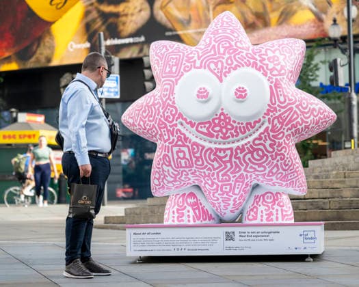 July 28, 2026, London, London, UK: LONDON, UK. Ã¢â‚¬ËœPink ShmugÃ¢â‚¬â ¢ in Piccadilly Circus. Art of London launches Mr DoodleÃ¢â‚¬â ¢s Doodle Discovery, a free art trail featuring a live doodling workshop and five specially commissioned sculptures across LondonÃ¢â‚¬â ¢s West End by internationally acclaimed artist Sam Cox, known professionally as Mr Doodle. The public art experience is on display until 30 August 2026. London UK  - ZUMAl94_ 20260728_zaf_l94_017 Copyright: xStephenxChungx
