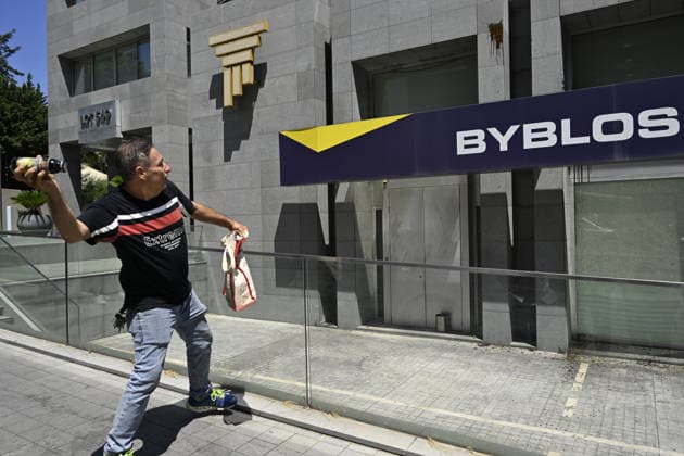 Depositors protest frozen savings at banks in Lebanon BEIRUT, LEBANON - JULY 28: A man throws an object as people, who are unable to withdraw their money after all foreign currency deposit accounts in the country were frozen in 2019 to prevent the depletion of foreign exchange reserves, stage a protest in Beirut, Lebanon on July 28, 2026. Houssam Shbaro Anadolu Beirut Lebanon. Editorial use only. Please get in touch for any other usage.  Copyright: x2026xAnadoluxHoussamxShbarox