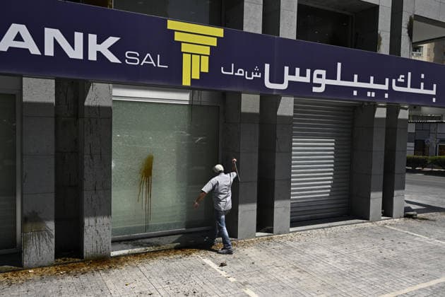Depositors protest frozen savings at banks in Lebanon BEIRUT, LEBANON - JULY 28: A man strikes bank with a hammer as people, who are unable to withdraw their money after all foreign currency deposit accounts in the country were frozen in 2019 to prevent the depletion of foreign exchange reserves, stage a protest in Beirut, Lebanon on July 28, 2026. Houssam Shbaro Anadolu Beirut Lebanon. Editorial use only. Please get in touch for any other usage.  Copyright: x2026xAnadoluxHoussamxShbarox