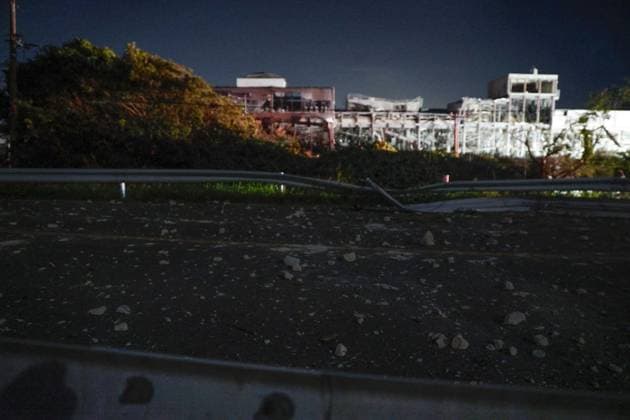 Strong quake jolts southwestern Japan Photo taken on July 28, 2026, shows a destroyed Aeon Mall building (back) in Kashima, Kumamoto Prefecture, following an explosion after a magnitude 7.1 earthquake shook the southwestern Japan prefecture. Many people are feared trapped inside the building.  A14AA0005624336P