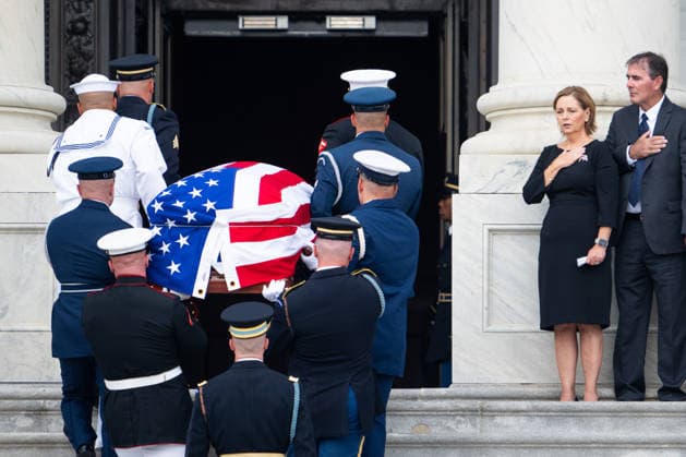 Sen. Lindsey Graham Congressional Tribute UNITED STATES - JULY 28: Sen. Darline Graham, R-S.C., and her husband Larry Nordone look on as the Armed Forces Body Bearer Team carries the body of her deceased brother Sen. Lindsey Graham, R-S.C., up the U.S. Capitol steps to the Congressional tribute in the U.S. Capitol Rotunda on Tuesday, July 28, 2026. Sen. Lindsey Graham died on July 11th from an aortic dissection. (Bill Clark CQ Roll Call) Washington DC United States EDITORIAL USE ONLY Copyright: x 2026xCQxRollxCallx BillxClarkx rollcallpix172253