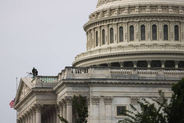 July 28, 2026, Washington, District Of Columbia, USA: Snipers stand guard on a rooftop at the U.S. Capitol building ahead of a memorial service for U.S. Senator Lindsey Graham (R-SC) in Washington, D.C. on July 28, 2026. Washington USA  - ZUMAd227 20260728_znp_d227_008 Copyright: xBryanxDozierx