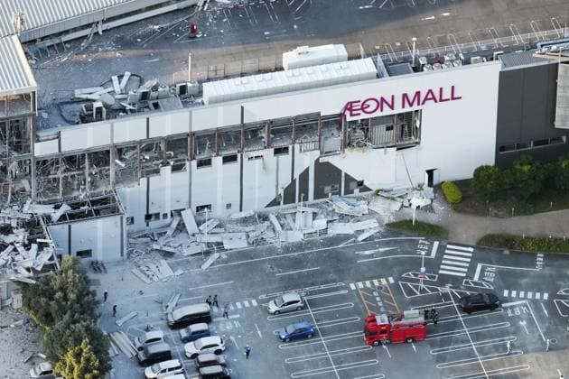 Strong quake jolts southwestern Japan Photo taken from a Kyodo News helicopter on July 28, 2026, shows a destroyed Aeon Mall building in Kashima, Kumamoto Prefecture, following an explosion after a magnitude 7.1 earthquake shook the southwestern Japan prefecture. Many people are feared trapped inside the building.  A14AA0005624342P